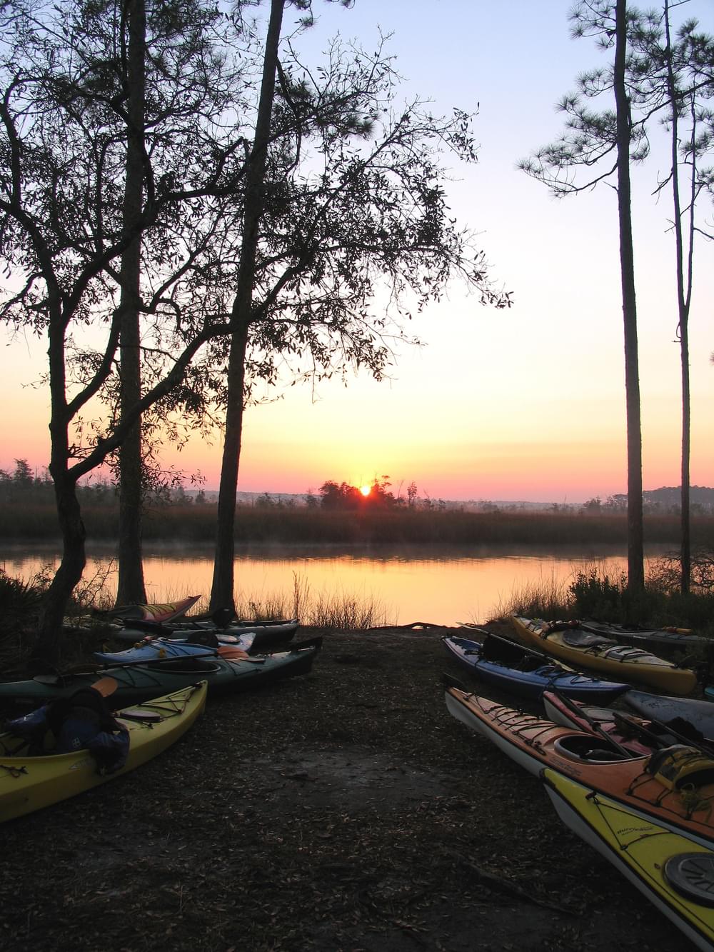 Sunrise at the campsite with kayaks on Segment 5 (Crooked River/St. Marks Refuge) of the Florida Circumnavigational Saltwater Paddling Trail