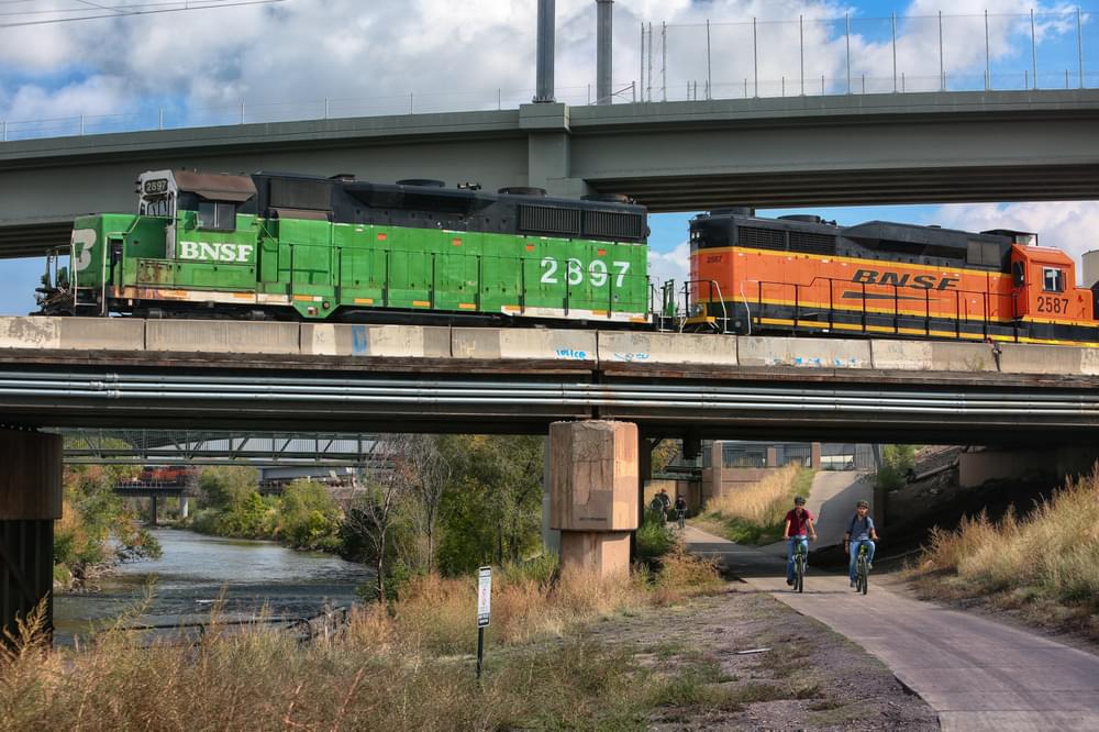 Hugging the eponymous Platte River, the trail passes under several active freight and passenger rail tracks that serve Denver.