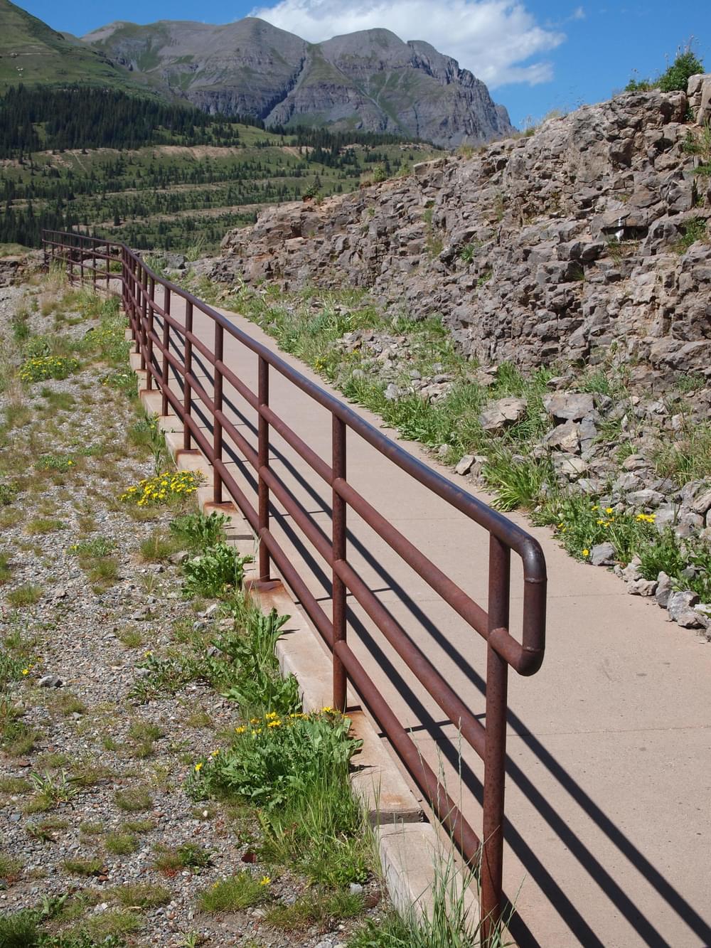 Trail to overlook at Molas Pass on the Colorado Trail; note handrail only along slope above parking lot