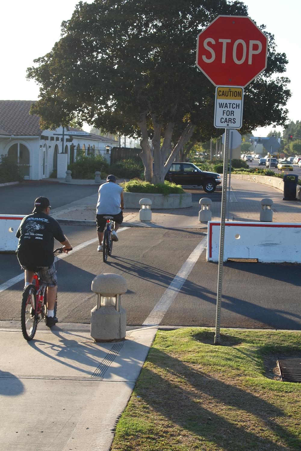 Where San Diego Harbor Trail crosses high-volume Coast Guard entrance, stop sign as well as "Caution watch for cars" sign warn trail users