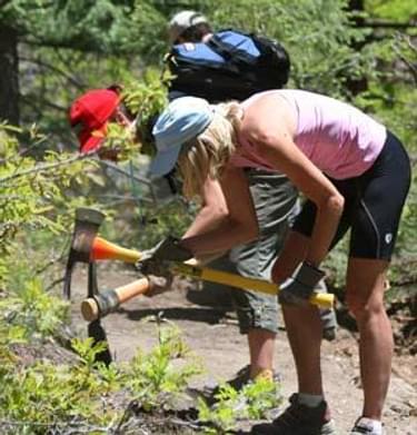 Volunteers for trail work include equestrians, hikers, and cyclists