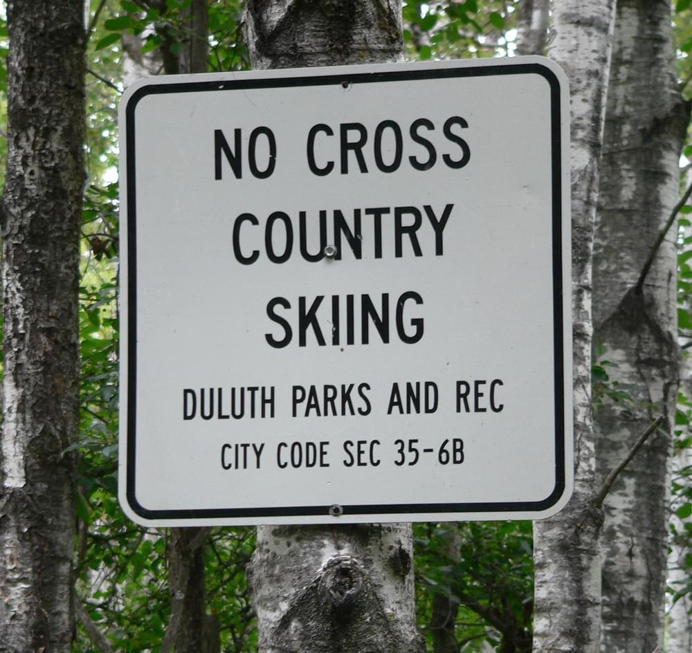 Blaze-style plastic sign nailed to Aspen tree on the Superior Hiking Trail near Duluth, Wisconsin