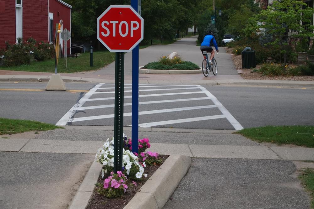 Planters encourage trail users to slow at road crossing; White Pine Trail, Rockford, Michigan