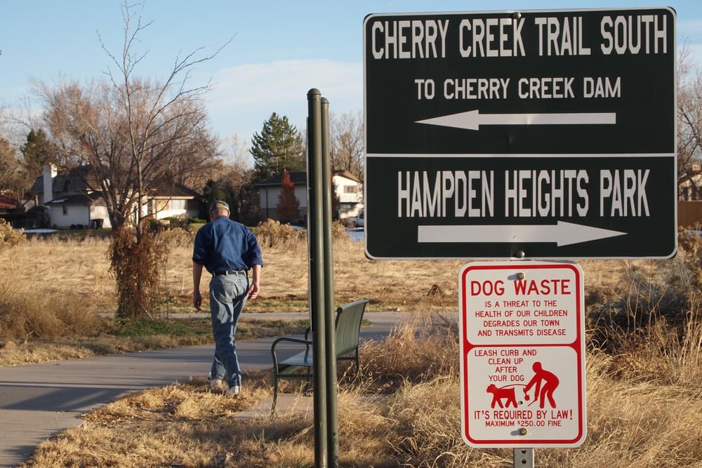 Sign directing users to either Cherry Creek Trail or trail to Hampden Heights Park in Denver, Colorado