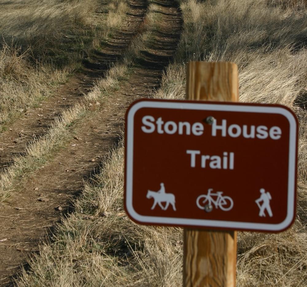 Trail identity sign includes symbols for permitted uses on the Bear Creek Greenbelt in Lakewood, Colorado