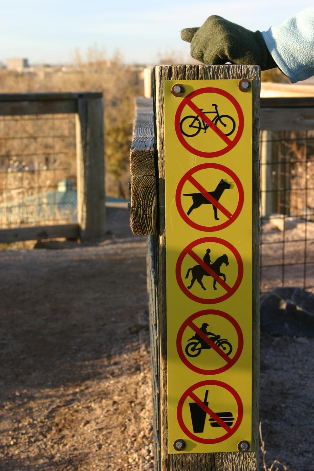 Logo sign showing only prohibited activities on the Bluff Lake Trail; Denver, Colorado