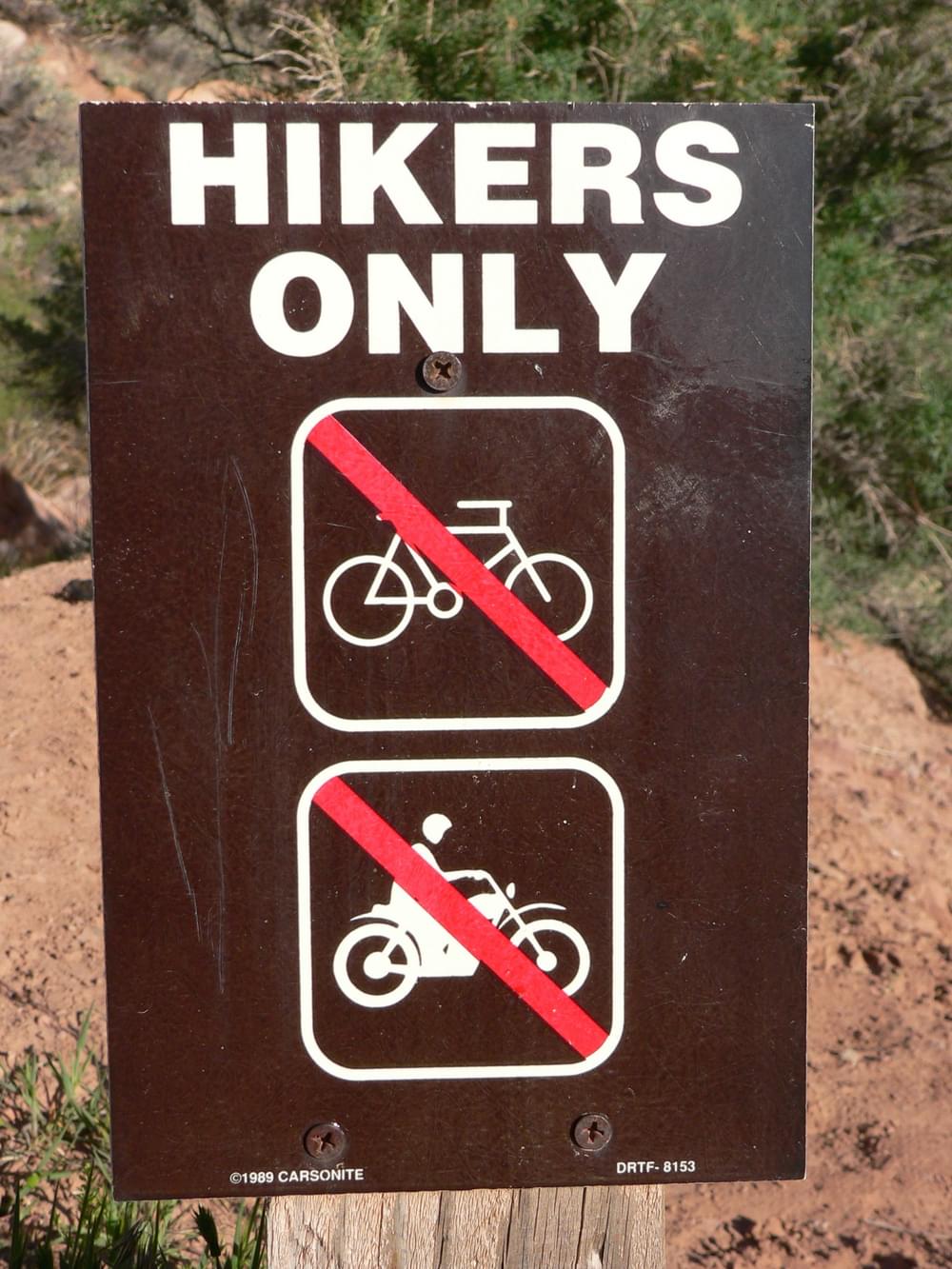 Silkscreened metal sign on a Bureau of Land Management trail near Moab, Utah