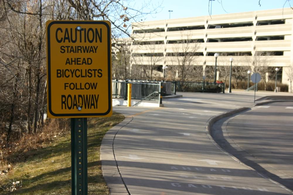 Bikeway intersects pedestrian route as Cherry Creek Trail skirts shopping center in Denver