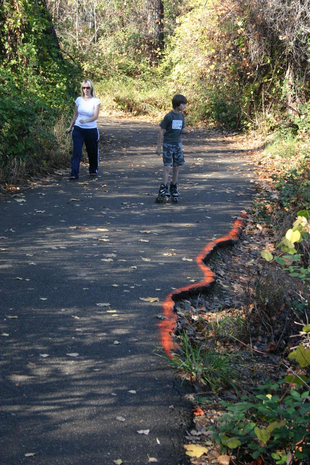 Dayglo paint alerts trail users of drop-off; Sacramento River Trail, Redding, California