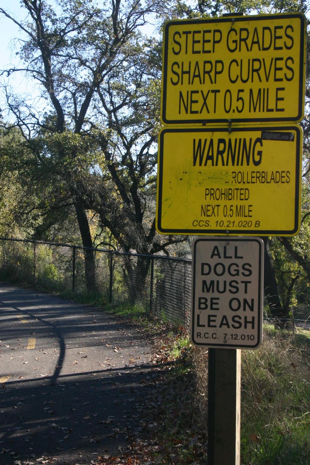Sign alerts users that flat trail along river climbs hill; Sacramento River Trail, Redding, California