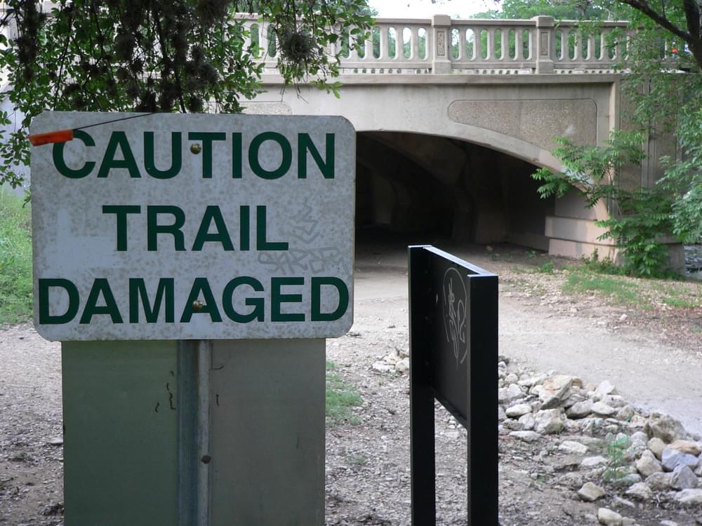 Warning sign on Waller Creek Trail after flooding; Austin, Texas