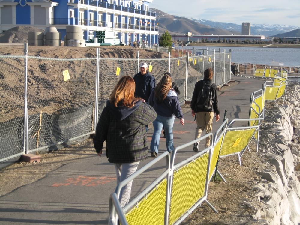 Fences keep trail users away from retaining wall drop-off, and out of earth moving area; Sparks Marina Park near Reno, Nevada