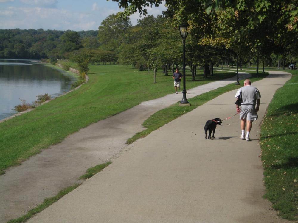 Runners use the soft surface path along paved Schuylkill River Trail, Philadelphia, PA