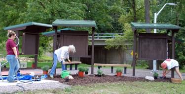 Volunteers from the Platteville Community Arboretum preparing the trailhead for the Grand Opening ceremony; photo by Gary Tuescher