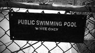 A sign from a public swimming pool in Alabama declaring the pool as a "WHITE ONLY" area.