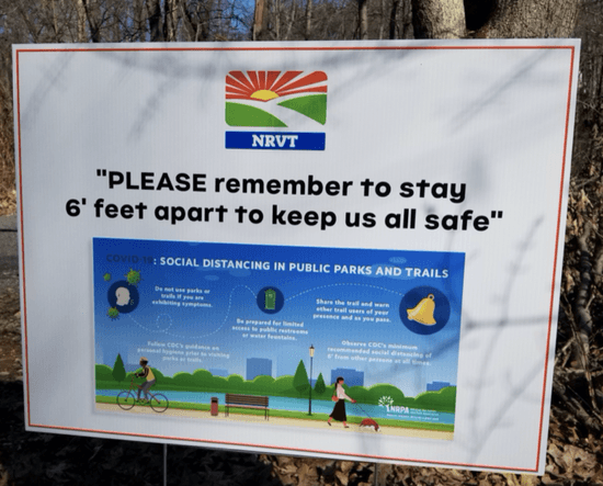 New signs have gone up on the Norwalk River Valley Trail in Connecticut to encourage social distancing. Image via Good Morning Wilton