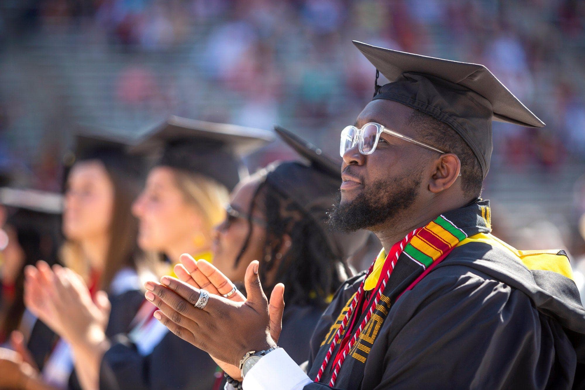 Graduate at commencement wearing regalia