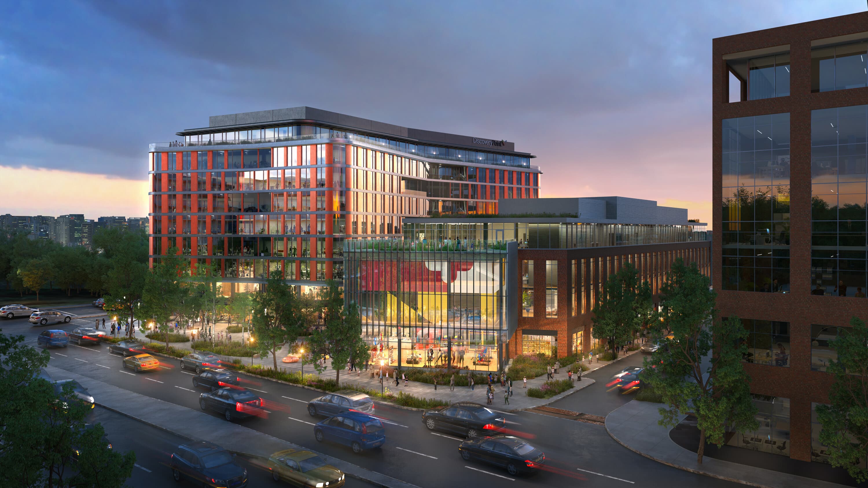 Discovery Point at lit up at dusk with warm lighting spilling out onto communal areas