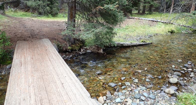 The bridge across Bear Valley Creek near the Upper Trailhead.  Other big water crossings also have bridges going up to the lake. Photo by David Lingle.