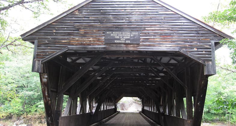 Albany Covered Bridge located in Albany, New Hampshire. Photo by Waz8.