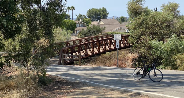 Two bridges cross the creek. One by Trabuco rd and the other just north of Jeronimo rd.