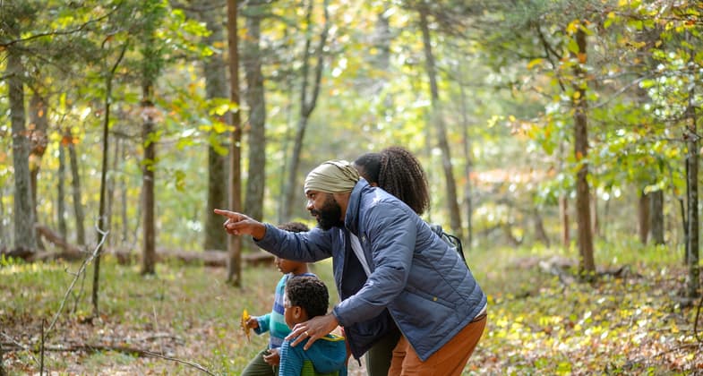 A family stops along the trail at Blevins Gap Nature Preserve to observe. Photo by Lauren Sanderson. Photo by Bob Goodwin