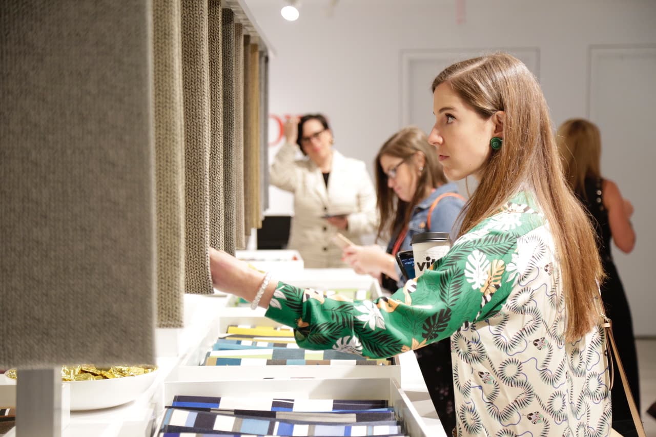 Attendee looking at textile samples