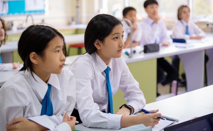 Children in class wearing School Uniform