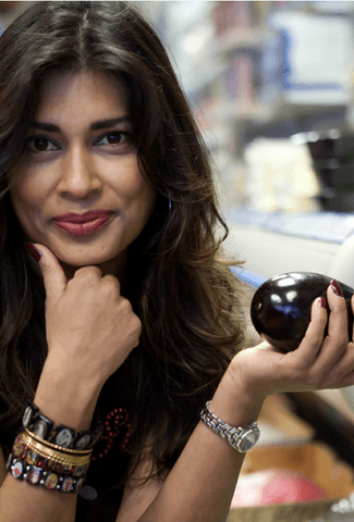 Nisha Katona holding an aubergine
