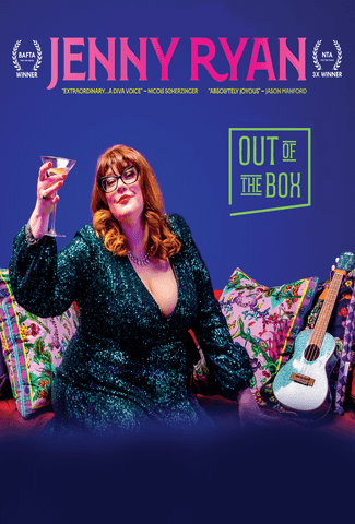 A woman with ginger hair, wearing glasses and a green sequin dress sat on a sofa with a martinin glass held up in the air