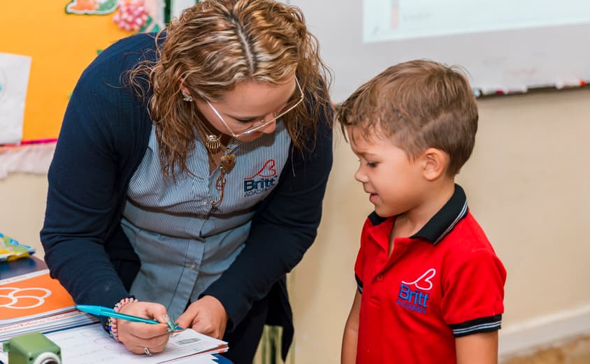 Student getting help from teacher