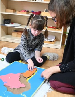 Child and teacher in Montessori nursery