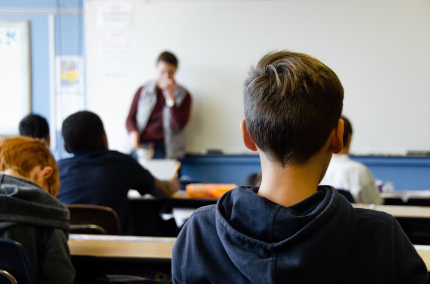 Student listening to teacher