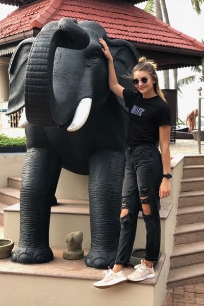 Alumna Halston Strange poses with an elephant statue. Alumna Halston Strange poses with an elephant statue.