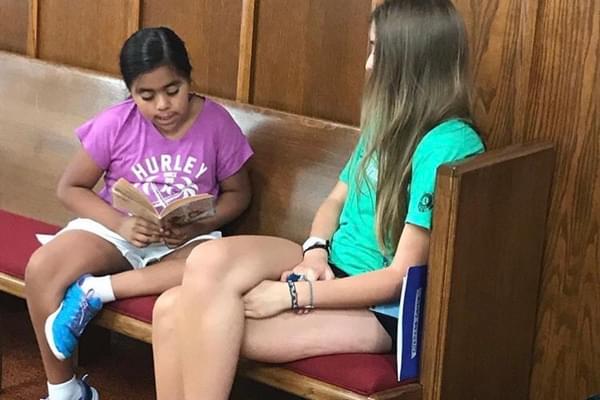 Madison Waller reading with one of the Project Transformation campers. Madison Waller reading with one of the Project Transformation campers.