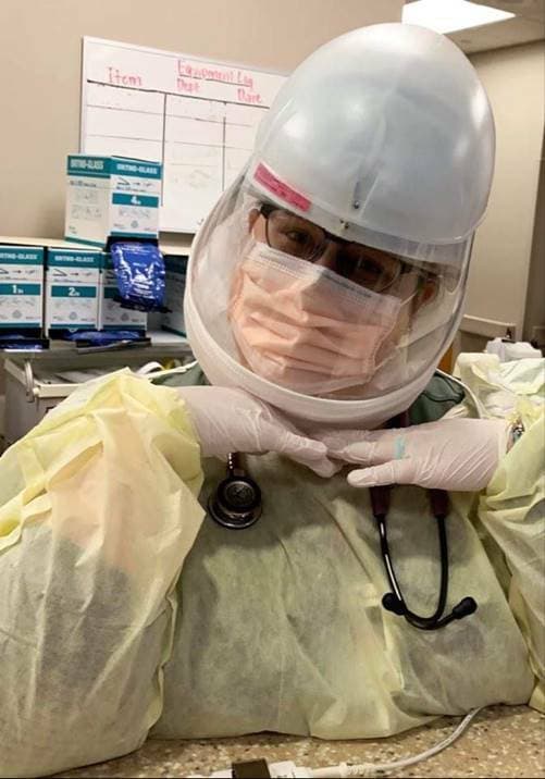 Nursing alumna Sarah Poteet poses in heavy protective medical gear Nursing alumna Sarah Poteet poses in heavy protective medical gear