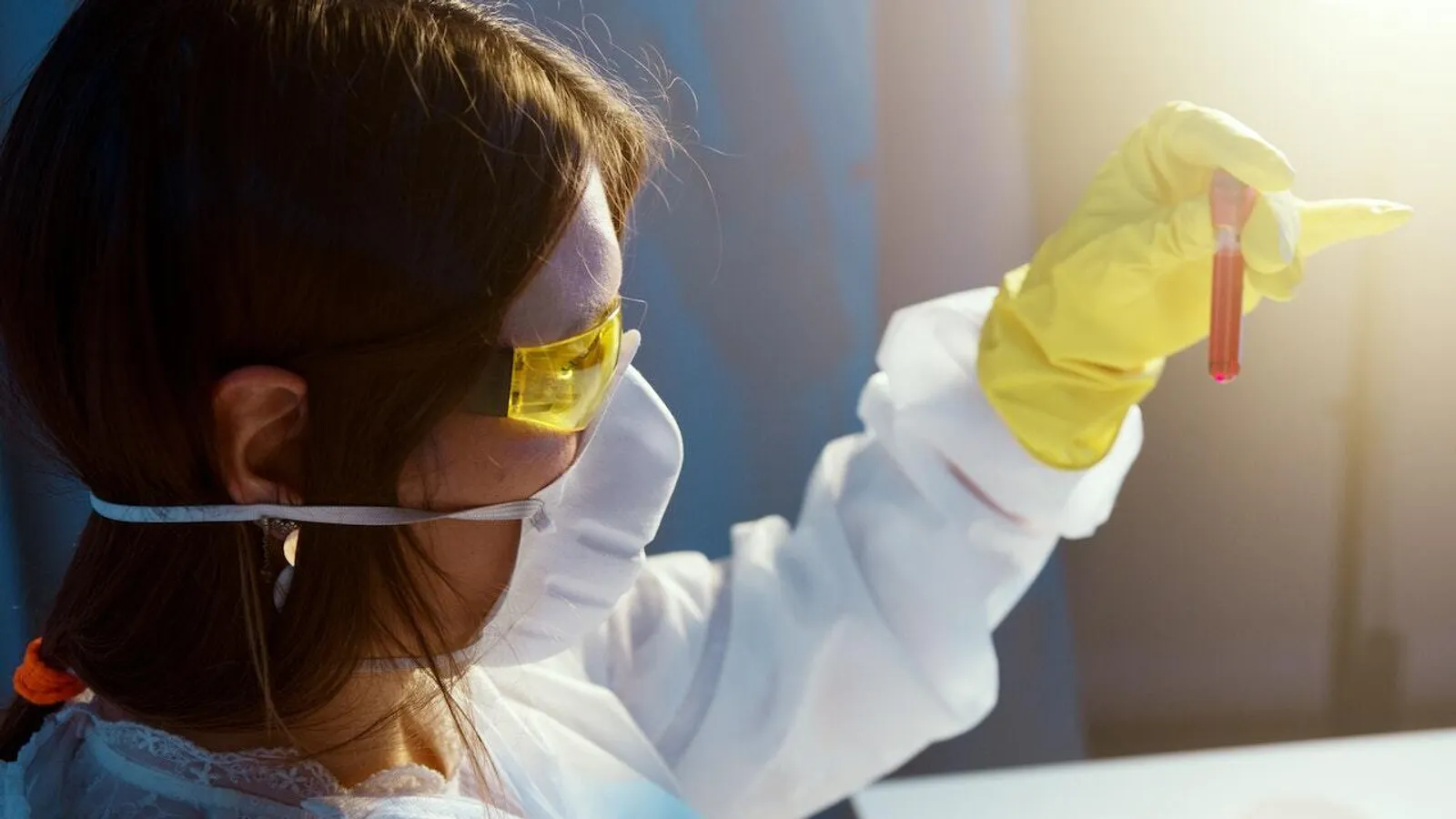 Woman examines sample