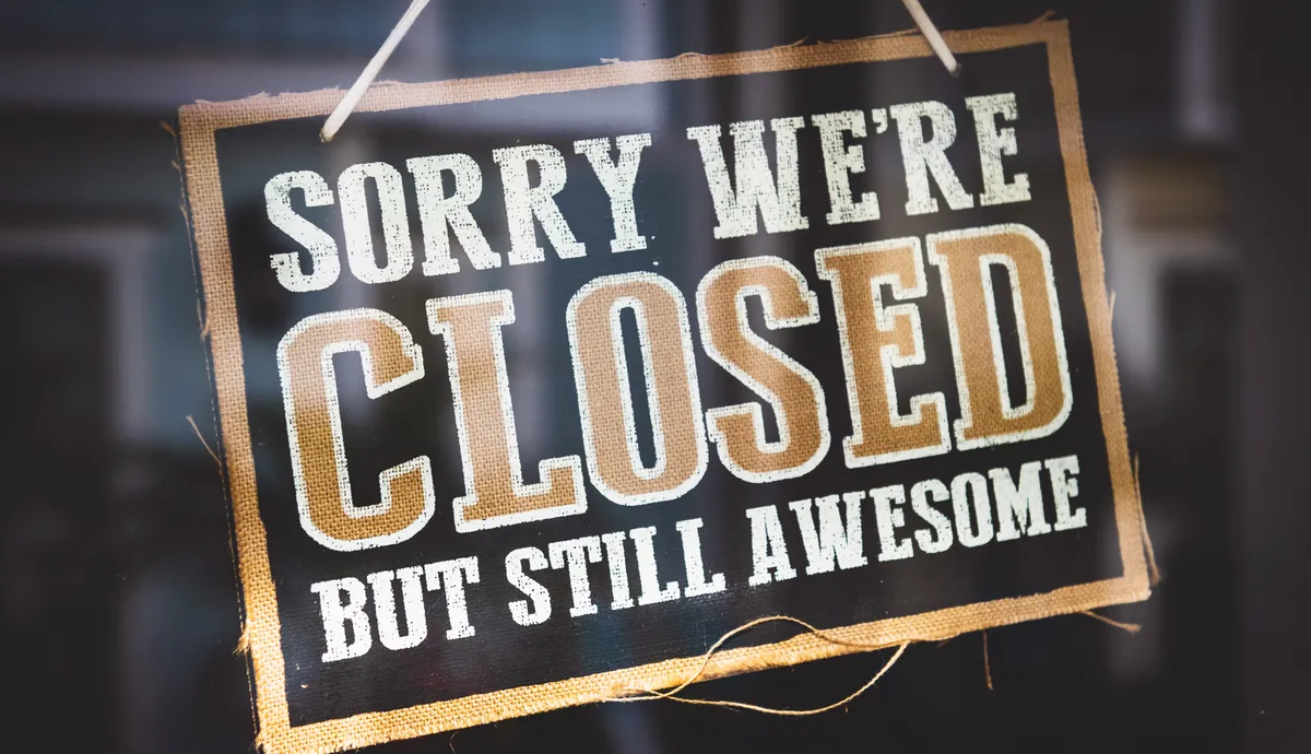 Sign stating sorry were closed but still awesome