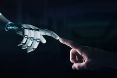 3D rendering of a robot hand making contact with human hand on a dark background.
