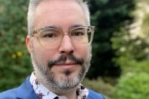 A photograph of Michael Costa. He is wearing glasses and has facial hair. Profile Photo