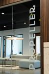 A glass door with the Propeller consulting logo on it