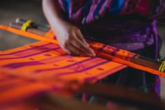 Mexican woman weaving tapestry using traditional weaving techniques. Photo by Los Muertos Crew via Pexels.com