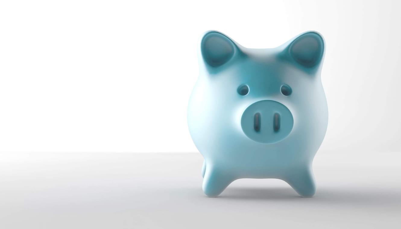 A teal piggy bank set against a white background.