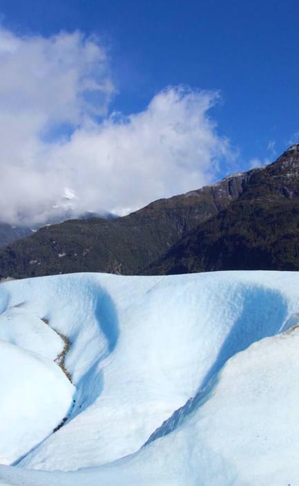 Chile patagonia carretera austral exploradores glacier guide walking onto left hand edge