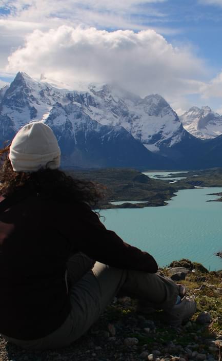 Chile patagonia torres del paine patagonia camp girl sitting view over massif