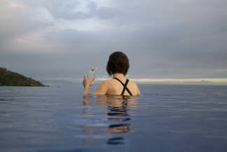 Costa rica pacific punta islita infinity pool woman