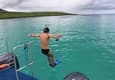 Ecuador galapagos islands land based galapagos jumping off boat to snorkel