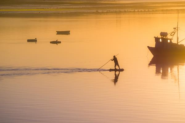 Chile chiloe fisherman sunset adobe stock