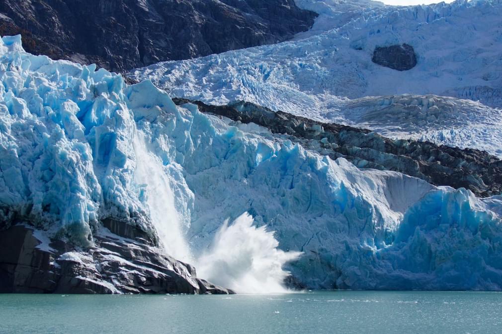 Chile patagonia carretera austral ice calving from leones glacier c pura aventura thomas power