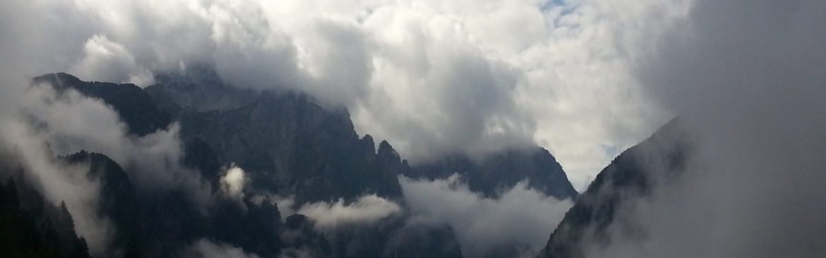 Accursed Mountains Emerging From Clouds